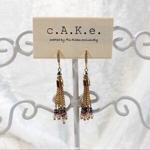 cAKe fringe drop earrings.